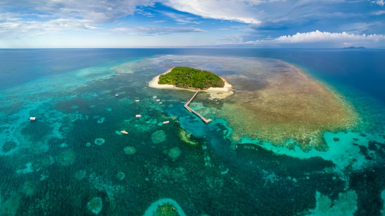 Wide angle aerial view of Green Island and its surrounding corals